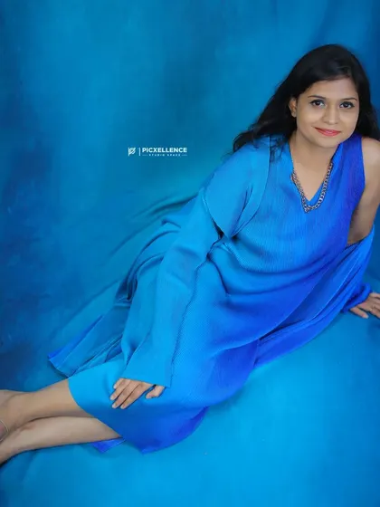 A confident shot of me in the peacock blue outfit. I love helping my clients find the perfect dress that makes them feel this good.