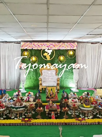 A wide view of a baby shower setup in a large hall, showing how my decorations can fill and transform a space.