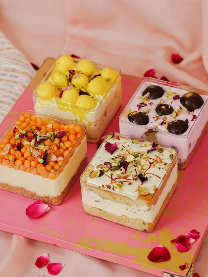 A modern twist on classic sweets. Our Mithai Trifles, including Gulab Jamun Cheesecake and Kesar Rabdi Tres Leches, are a perfect fusion dessert for Rakhi.