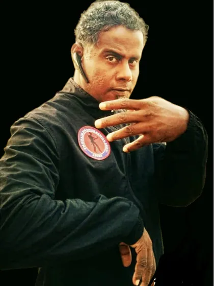 A portrait of me in my teaching uniform. The patch on my chest is our academy's symbol, a mark of the discipline and power we cultivate.