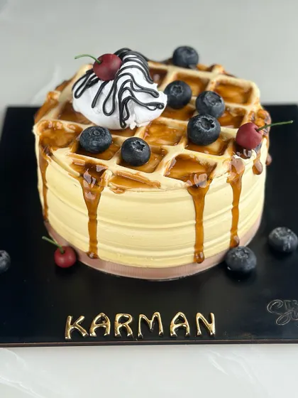 Sweeten your day with our waffle-themed cake. Combining the best of breakfast and dessert, it’s a stack of joy with every slice, drizzled with syrup and topped with berries.
