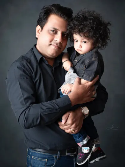 A father and his son share a quiet moment, a simple and strong portrait.