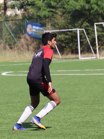 Anirudh in action during a match, demonstrating the speed and agility I cultivate in my forwards.
