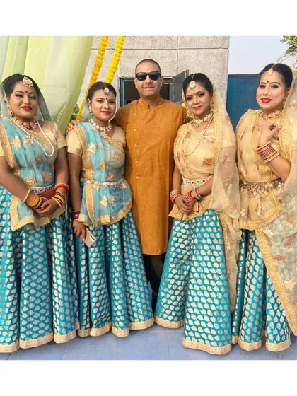 Our team of dancers posing with a client at an army celebration. We are proud to perform at diverse events and bring joy through our cultural performances.