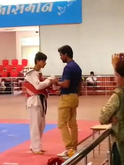 Presenting an award to one of my star students, Hemant Rawat, after a competition. Recognizing and encouraging talent is a key part of my coaching.