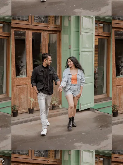 A walking shot of the couple, hand in hand, exploring the charming streets of Mumbai.