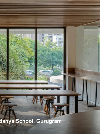 A learning space at Vedanya School, Gurugram, with large windows connecting the interior to the lush greenery outside. We design future-proof spaces that are sustainable, efficient, and adaptable to the evolving needs of communities.