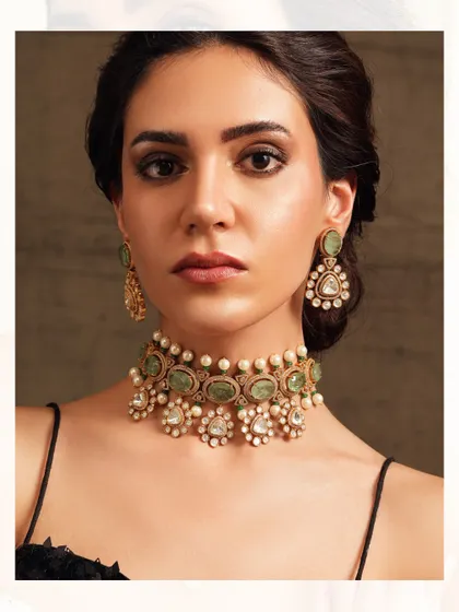 A beautiful polki choker with pastel green stones and floral diamond motifs.