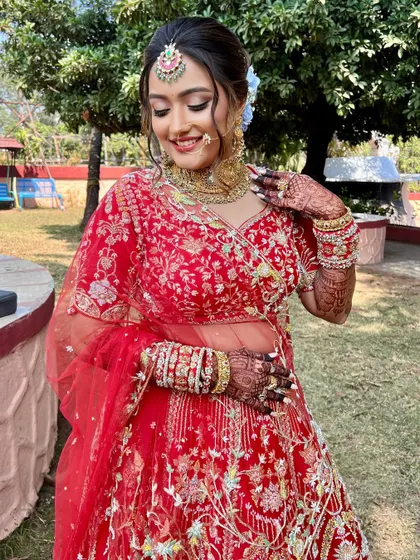 A candid moment of the bride, her makeup looking fresh and flawless in the natural light.
