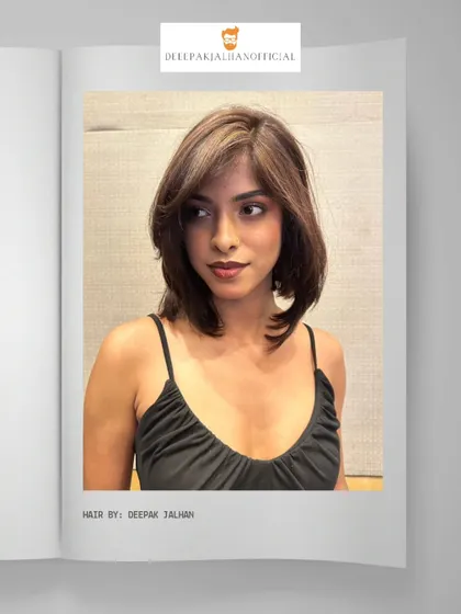 This chic hair makeover features textured layers and a rich brown color with subtle highlights. It's a modern, stylish cut that redefines volume and dimension.