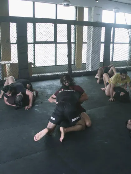 Our grappling game is always on point. A wide view of our BJJ class, with multiple pairs drilling techniques and rolling.