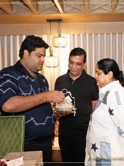 A guest at our Ahmedabad launch event, getting a closer look at one of my silver-finished bowls. I love sharing the details and craftsmanship of each piece.
