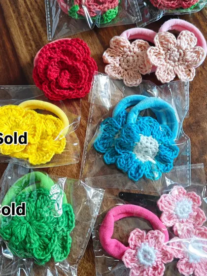 Some of my floral hair accessories are ready for sale. The yellow and green scrunchies have been sold, but the others are still available.