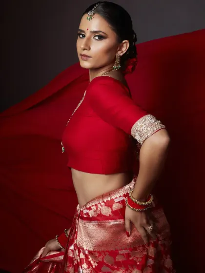 This look is my 'lal ishq', my pure passion for creating something powerful and timeless. I focused on a flawless base, dramatic smokey eyes, and a defined brow to complement the rich red Banarasi saree, creating a modern yet classic editorial statement.