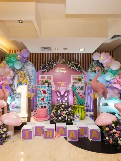 Ishaara's 'Alice in Wonderland' party was a feast for the eyes. The stage was filled with details like giant mushrooms, a flamingo, the Cheshire Cat, and a light-up '1'.