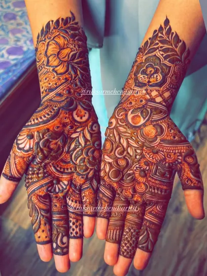 A stunning example of a fully developed henna stain, showcasing the intricate details of the bridal design.