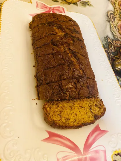 A freshly baked loaf of my Nutella swirl Banana bread, sliced and ready to serve. It's a perfect teatime goodie.