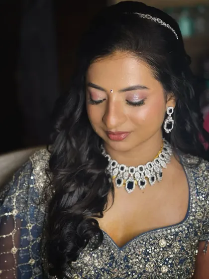 A close-up of the eye makeup. I used a shimmering pink and silver shadow to create a look that is both romantic and modern.