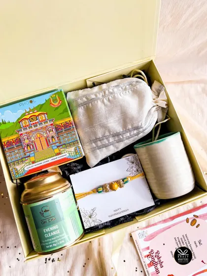 The 'Good Vibes Only' hamper, featuring herbal tea, incense cones, a ceramic mug, and a simple, elegant rakhi.