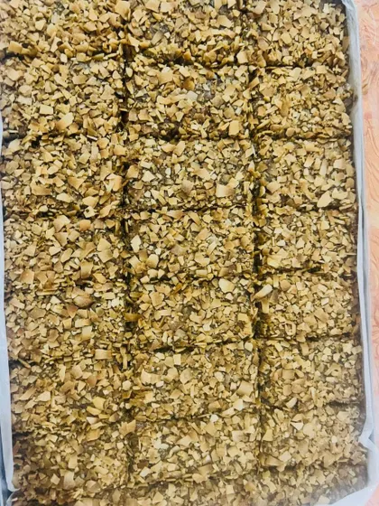 This tray is filled with my Almond & Walnut with Cinnamon bars, topped with toasted coconut flakes. The warm spice of cinnamon pairs beautifully with the crunchy nuts.