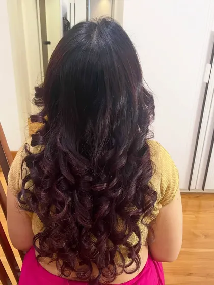 It's all about those perfect, bouncy curls. I specialize in creating soft, natural-looking hairstyles using your own hair that hold their shape without feeling stiff, perfect for an open-hair look.
