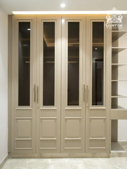 The full view of this elegant wardrobe, complete with an integrated open shelving unit for display items or daily essentials.