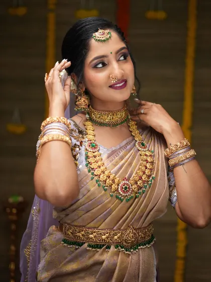 A gorgeous series of a model in a light purple saree, wearing our kemp stone bridal set. These photos show the jewellery from various angles, highlighting its beauty.