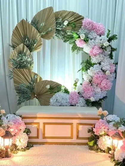 This beautiful setup combines soft pastel florals with modern boho elements like dried palm leaves, creating a trendy and romantic look for an engagement.
