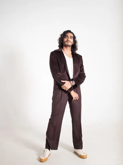 For this studio shoot, I styled Vishak Nair in a relaxed brown velvet suit. The look is a great example of smart-casual styling, perfect for interviews or less formal public appearances.