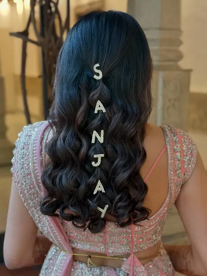 A closer look at the personalized name hairstyle. It's a unique and memorable detail that I love creating for my clients.