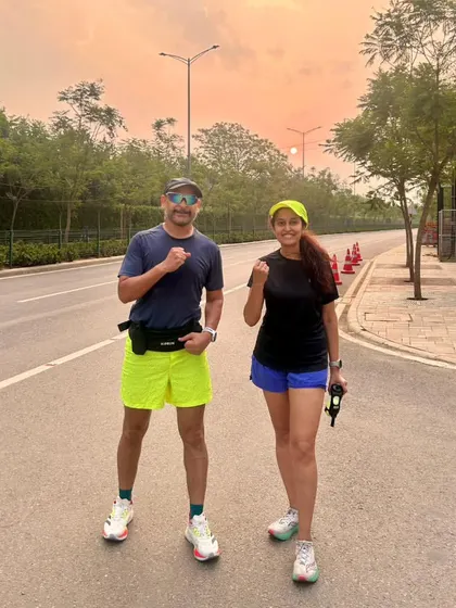 Two of our runners against the sunrise. This is the reward for those early morning alarms: quiet roads and a sky on fire.