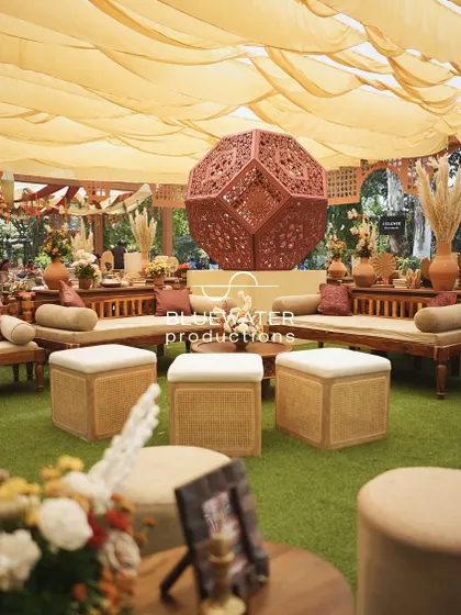 A view of the lounge area, showing the comfortable low seating and the large geometric sculpture.