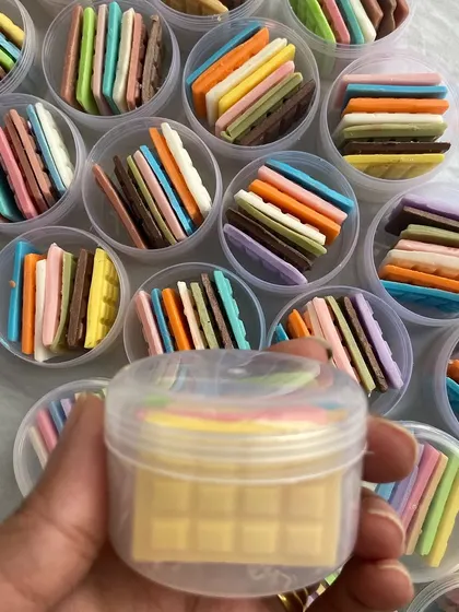 A closer look at one of my travel packs. You can see the small, chocolate-bar-like soap pieces inside, each with a different color and scent.