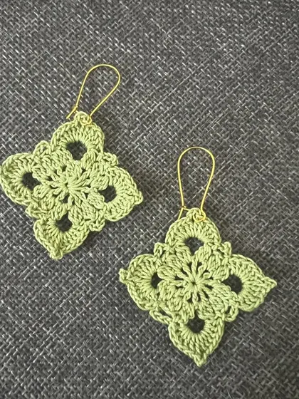 A lovely pair of Diamond Dangler earrings in a soft, sage green. Perfect for a subtle touch of color.