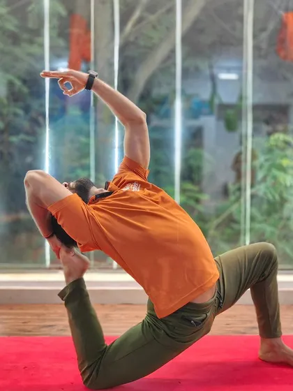 A powerful expression of the One-Legged King Pigeon Pose, showcasing a deep backbend and open chest.