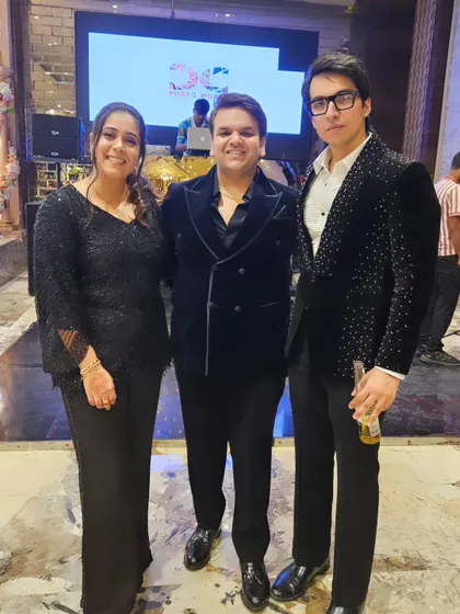 My clients and me at a recent event. It's always great to see the final creations, like this custom double-breasted tuxedo and embellished blazer, being enjoyed.