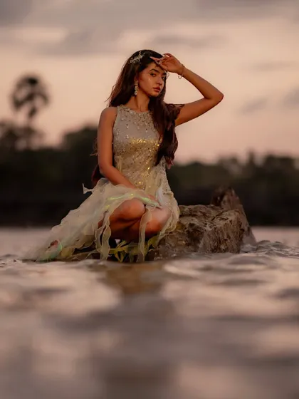 Another beautiful shot from Anushka Sen's music video. The custom dress looks magical in the water at dusk.
