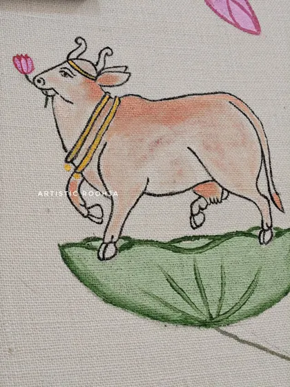 Another detailed shot of the Pichwai cow, this time smelling a lotus. These small narrative details are what make traditional art so rich and engaging.