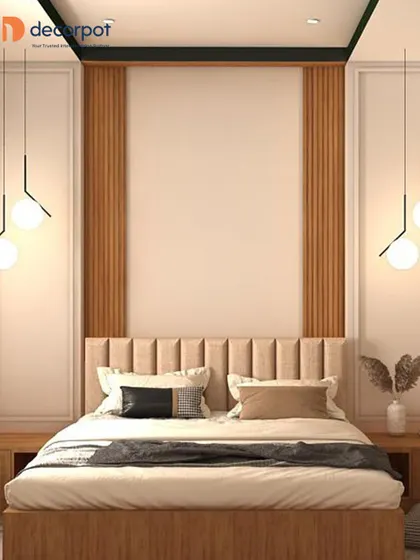 A serene bedroom design with a neutral color palette. The wall behind the bed features vertical wood fluting and clean white panels, with modern pendant lights adding a touch of elegance.