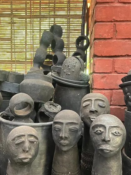 A collection of expressive black pottery figures from a local artisan studio in Hampi. These crafts inspire and are integrated into our hospitality projects to create a sense of place.