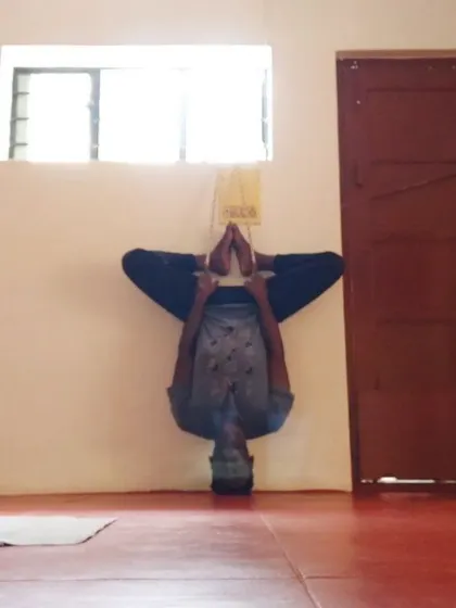 Another variation of a supported inversion, this time with legs in Baddha Konasana. This is therapy for the spine, taking gravitational pressure off the disks and creating space between the vertebrae.