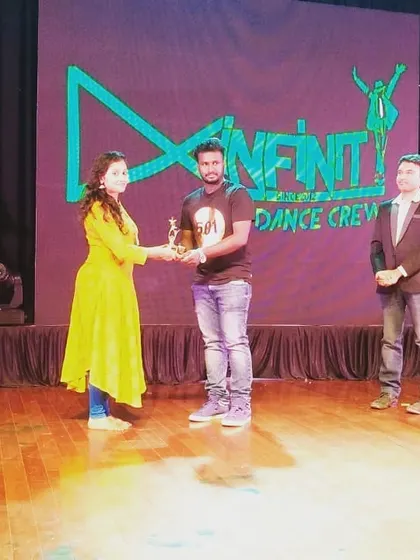 We are proud of our team's achievements in the dance community. Here we are accepting the runner-up trophy for the solo classical category at the Just Dance 2019 finale.