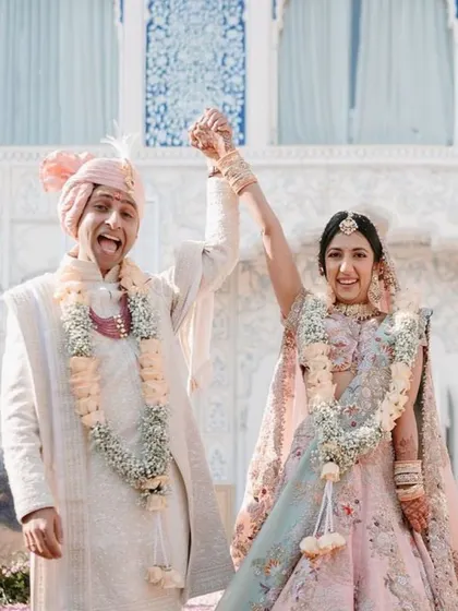 A moment of pure joy and triumph. This is what a dream wedding looks like, where every detail comes together to celebrate your union against a backdrop of architectural splendor.