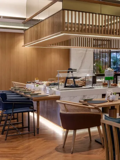Additional views of the Radisson Resort, Khopoli, showcasing various interior and exterior details, from lobby seating areas and restaurant layouts to guest room configurations and architectural elements.
