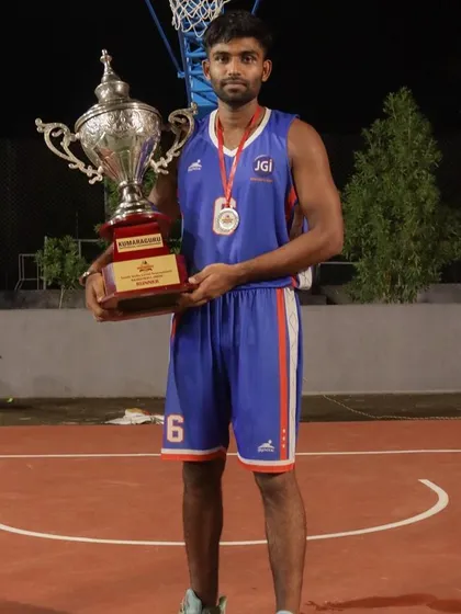 Holding the runner-up trophy from the Dr. N Mahalingam Trophy tournament. A tough competition that made us stronger.