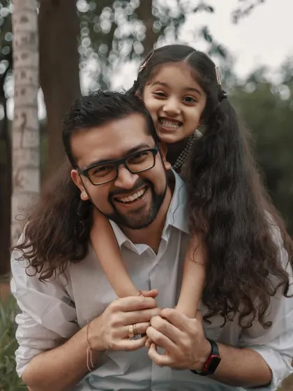 The bond between a father and daughter is a love story that lasts a lifetime. Capturing their shared laughter during a piggyback ride is a perfect example of the happy, authentic moments I live to photograph.