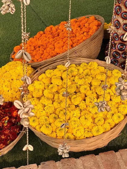 Baskets of fresh marigolds, a staple for auspicious and vibrant Indian pre-wedding ceremonies.