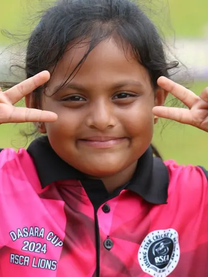 A young girl shows her excitement for the Dasara Cup tournament.
