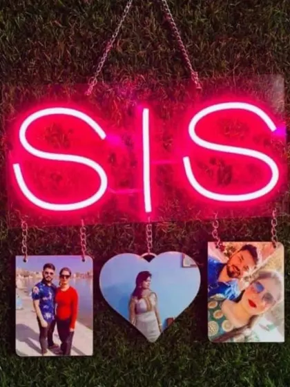 A unique gift for a sister on Rakhi, this neon "SIS" sign comes with hanging photo frames to display your favorite memories together.