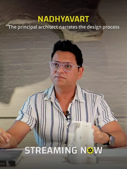 Here I am narrating the design process for Nadhyavart, a project where architectural prowess intertwines with nature's splendor. This image captures a moment of sharing the story behind the seamless fusion of concrete, wood, and light.